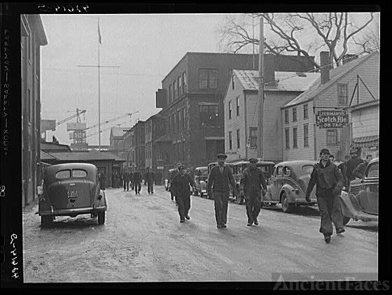 Men coming out of the shipyard at Bath, Maine, during the...