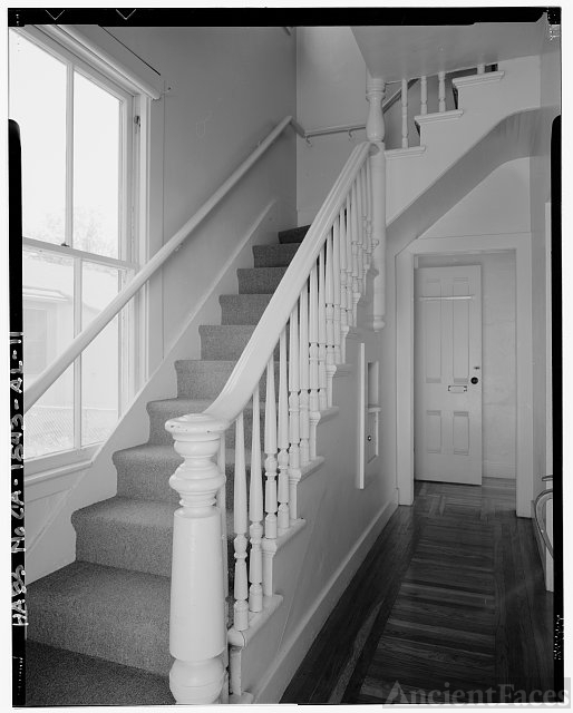 DETAIL OF INTERIOR STAIRCASE AT FRONT ENTRY, CAMERA...