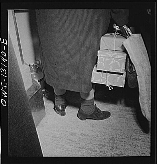 New York, New York. A shopper in R. H. Macy and Company...