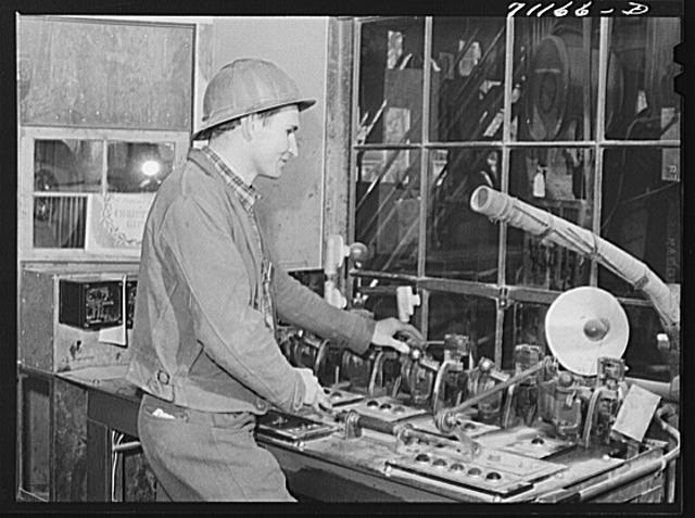 Worker who measures material going into concrete. Shasta...