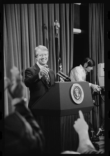 [President Jimmy Carter at a press conference, taking a...