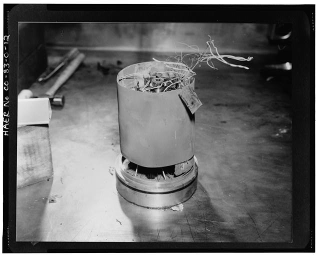 12. VIEW OF A SITE RETURN WEAPONS COMPONENT. AFTER...