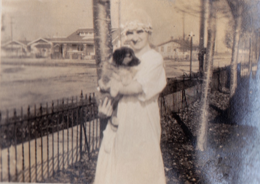 Girl holding dog