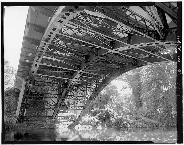 7. VIEW OF SPAN FROM BELOW WITH RIVERBANK AND BRIDGE...