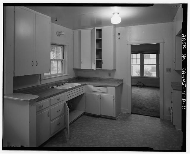 11. INTERIOR OF KITCHEN/UTILITY AREA SHOWING OPEN DOORWAY...