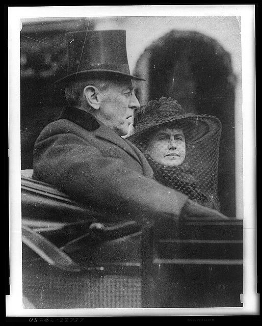 [Woodrow Wilson and wife riding in backseat of a carriage...