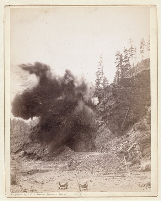 In mid air. A wonderful blast in building railroad to...