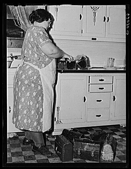 Mrs. Jones fixing lunch pails for her boarders. Radford,...