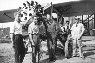 Men with plane at Mitchell Field 2