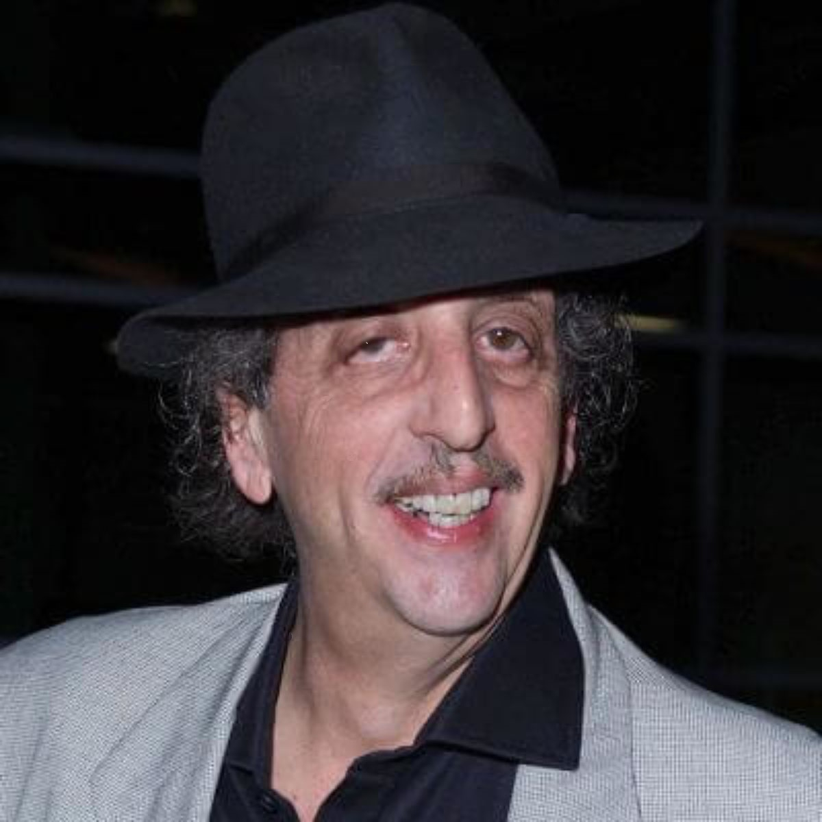 Vincent Smiling in a Fedora.