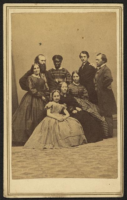 [Group portrait, possibly a family, with an African...