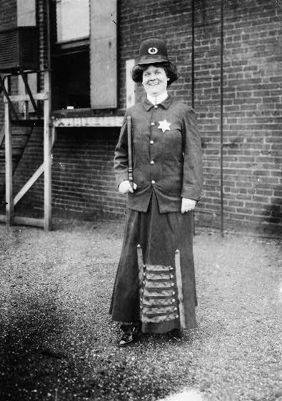 Suffragette in police uniform 
