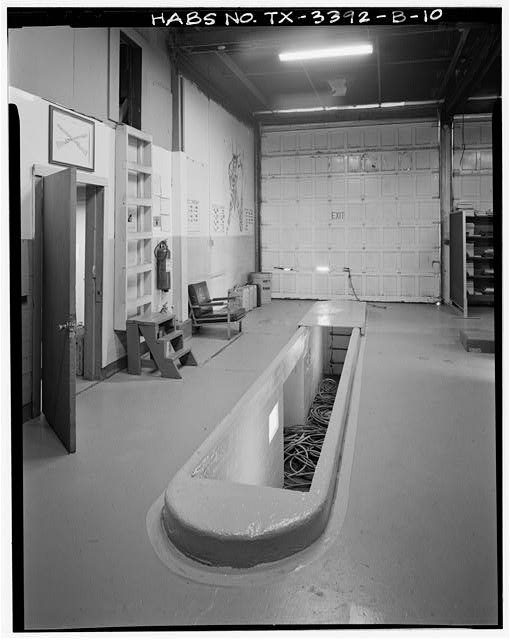 10. Interior view of shop area showing grease pit - Fort...