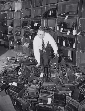 Martin Tytell with typewriters,