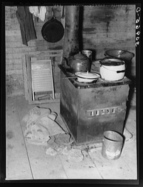 Kitchen stove and bag full of cow dung used as fuel....