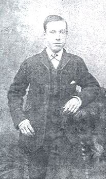 Young English Man leaning on chair