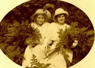 Two Women holding Ferns