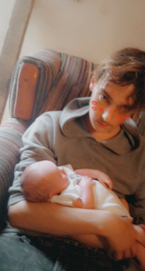 Nic holding his cousin Aj