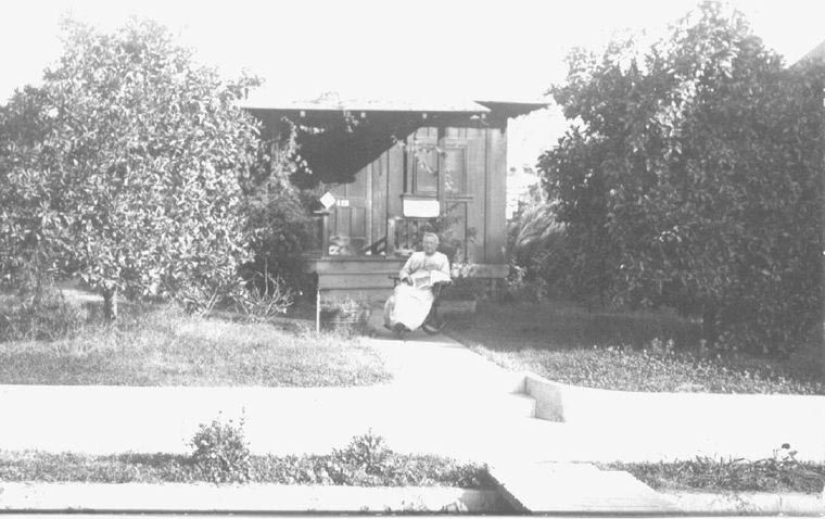woman in front of home