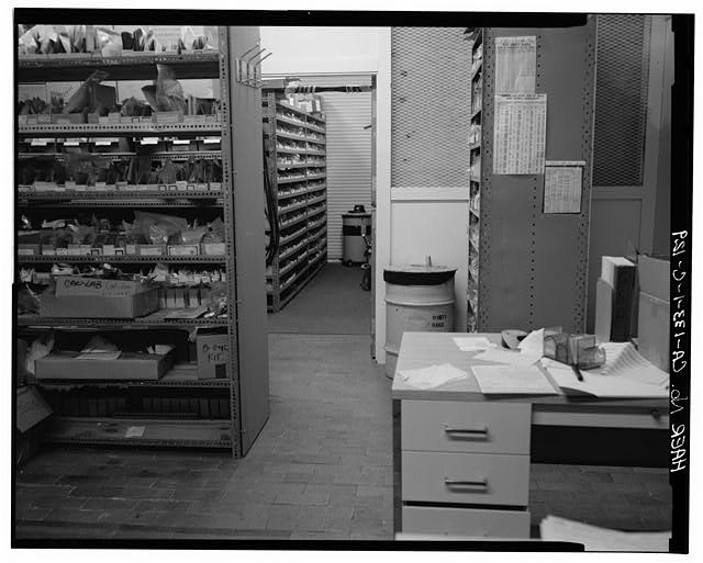 129. VIEW OF WEST SIDE OF ACID TRUCK ROOM (113), LSB...