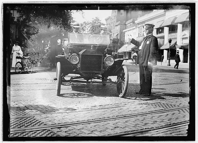 Herbert E. French in Ford stopped by traffic cop