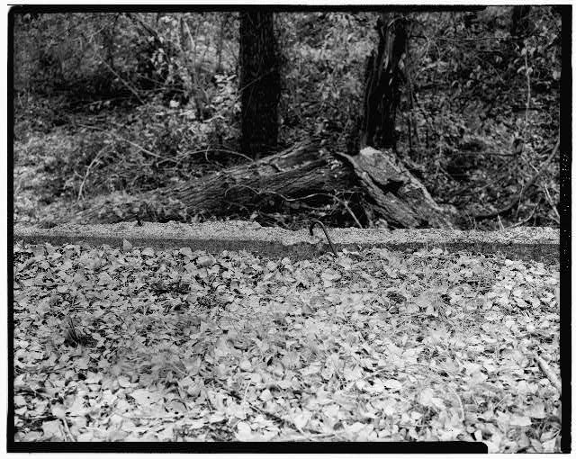 9. VIEW OF SOUTH SIDE OF BRIDGE RETAINING WALL, SHOWING...