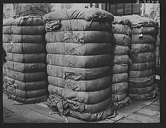 Discarded stockingss go to war. Bales of discarded silk...