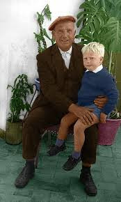 Ian  Oliver  Martin sitting on the leg of his baptismal godfather, Fernando Crespo Miranda