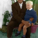 Ian  Oliver  Martin sitting on the leg of his baptismal godfather, Fernando Crespo Miranda