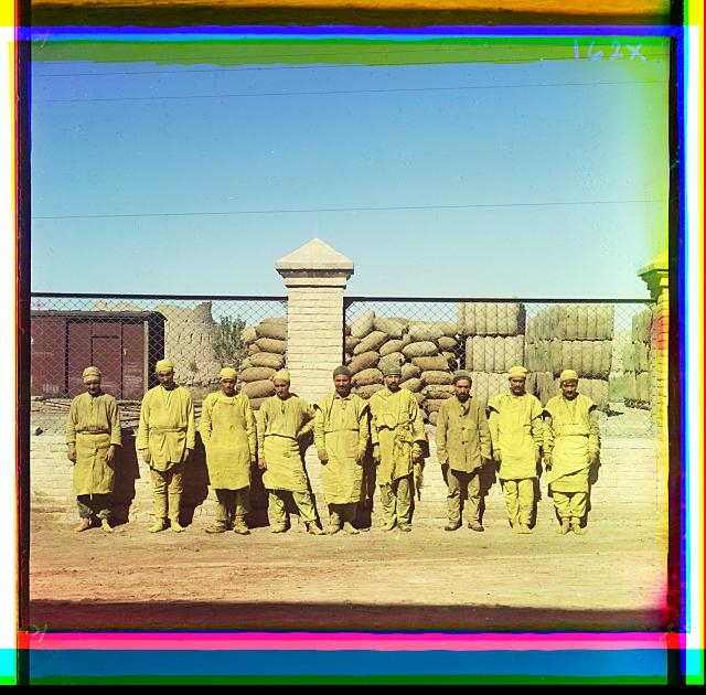 [Group of laborers standing, posed, in front of a...