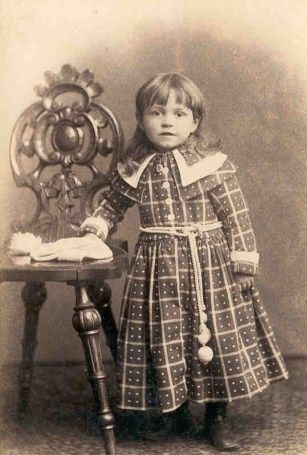 victorian girl in plaid dress