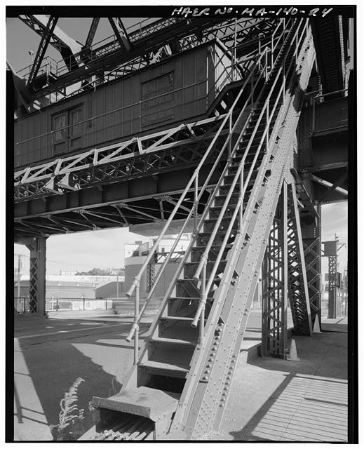 24. View of stair's built into diagonal post on west side...