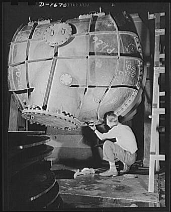 Shipbuilding (Newport News). This worker is touching up...