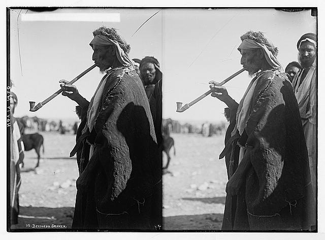 Costumes, characters, etc. Bedouin smoking long pipe