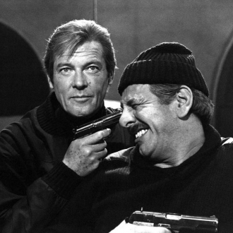 Topol with Roger Moore.