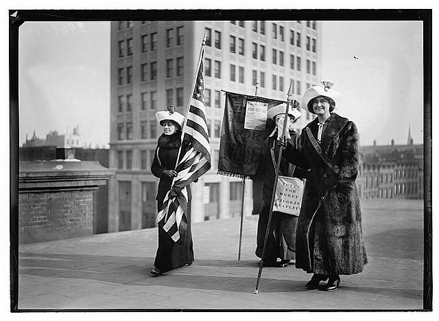 Suffragettes with flag