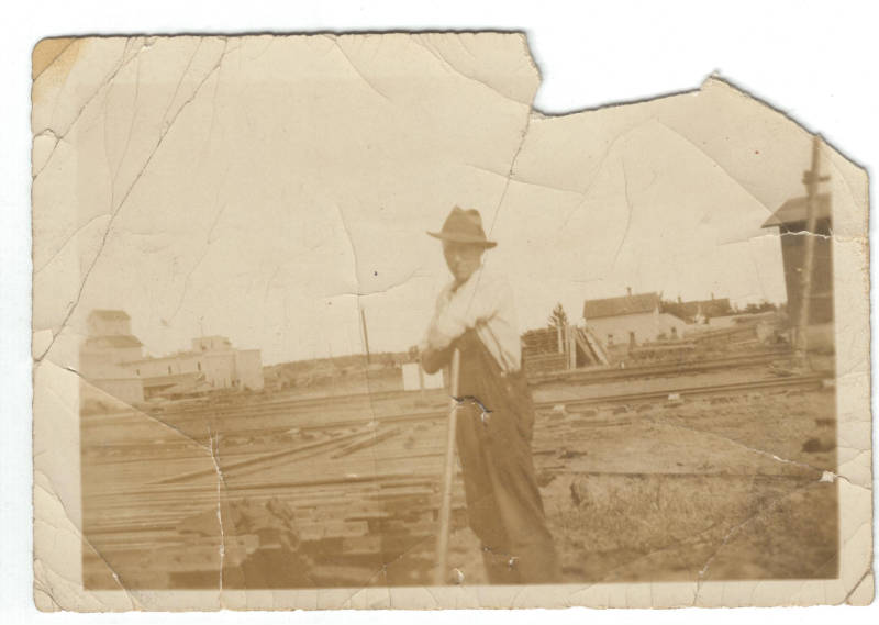 Unknown man working on railroad tracks