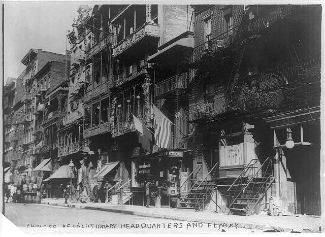 U.S. and Chinese flags hanging from Chinese revolutionary...