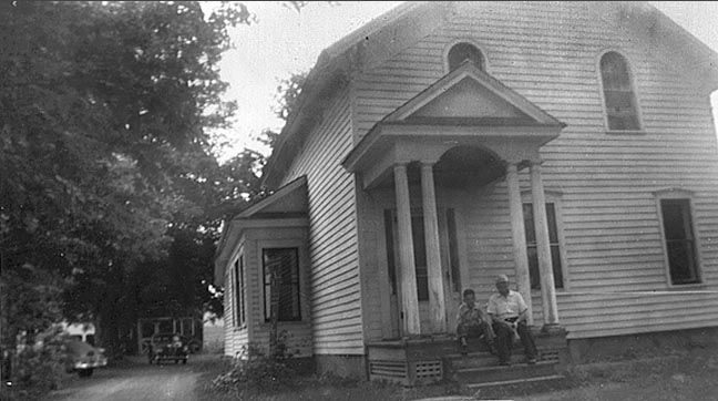 Unknown # 23 - House & people on steps