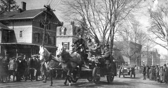 Vintage photo of firemen and their horse-drawn wagon