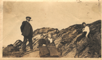 Four people on a giant rock Four people on a giant rock