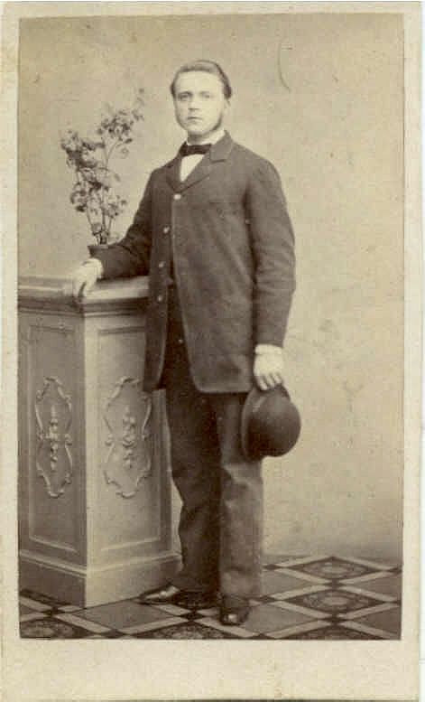 ManHoldingBowlerHat-Studio
