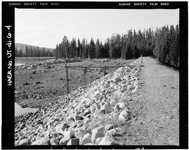 4. VIEW OF CREST AND UPSTREAM FACE OF DAM, WITH OUTLET...