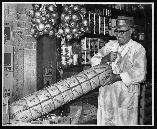 [Anthony Nocella lifting a 110 pound provolone cheese at...