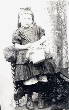 Small English girl (Lizzie) holding a basket