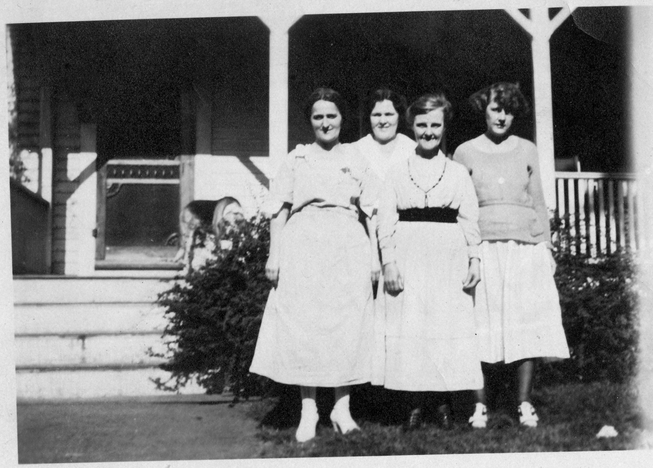 Four Ashenden ladies in front of their porch
