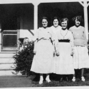 Four Ashenden ladies in front of their porch