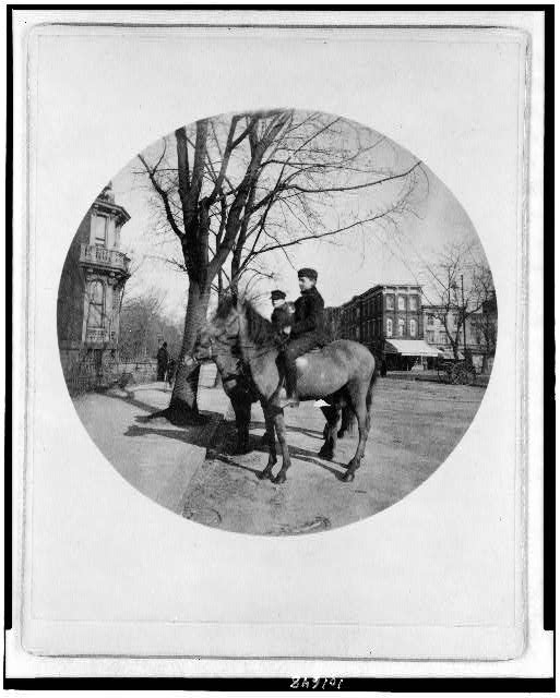 [Two boys on horses at corner of 14th St. and I St. N.W.,...