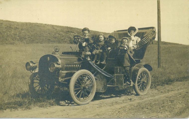 Family in old car