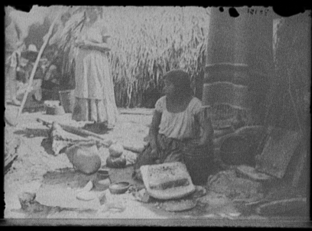 [Woman with pottery at market, probably Mexico]